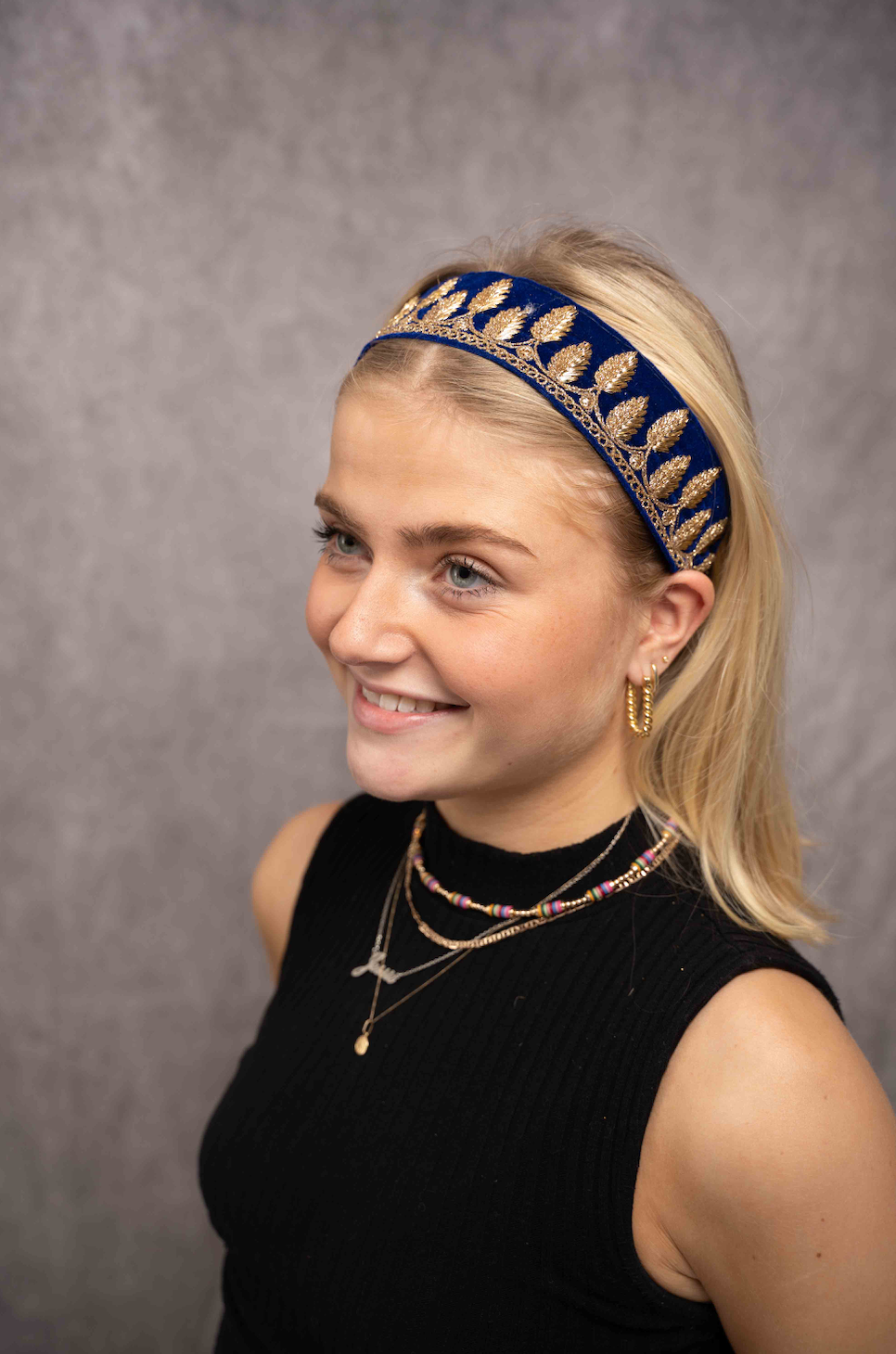 Deep blue velvet, embroidered with golden threads.