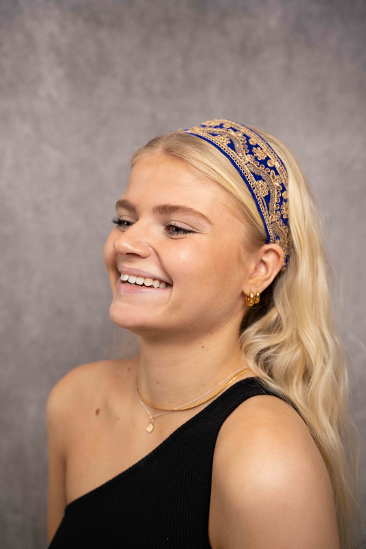 Deep velvet blue ribbon, embroidered with gold sequins and threads.