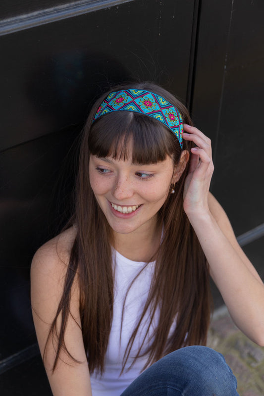 Turquoise and navy headband, intersected with hints of fuchsia.